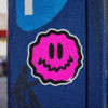 square-pink-antsy-face-round-sticker-on-a-blue-parking-meter.