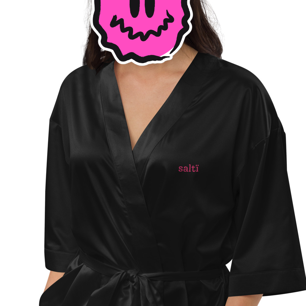the front of a drag queen sating robe black
