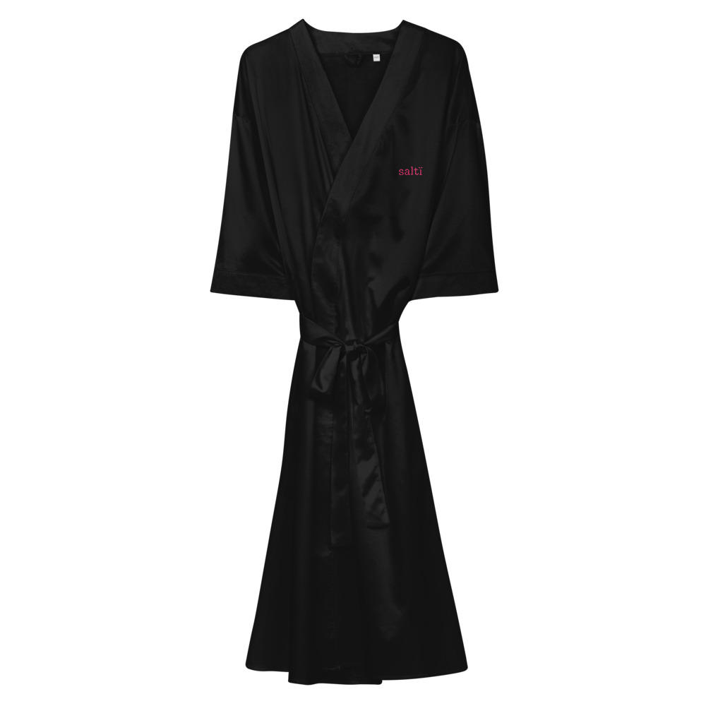the back of a drag queen sating robe in black